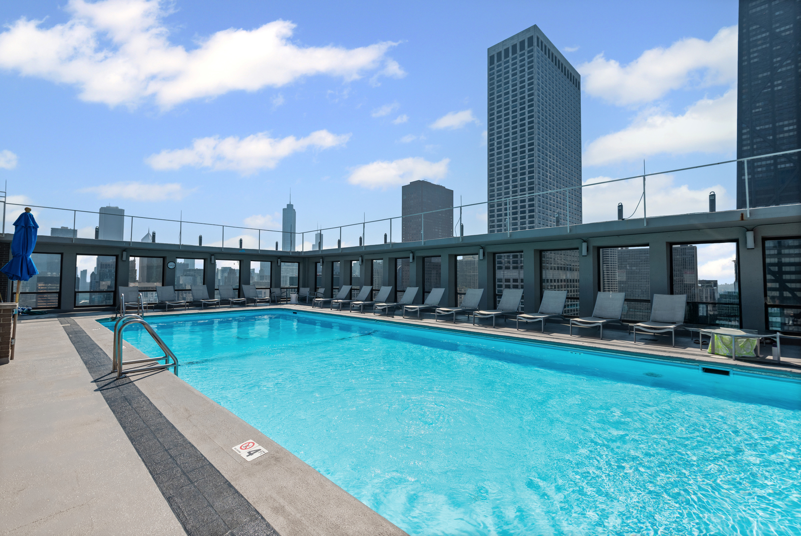 260 East Chestnut Street, Unit 611 Chicago, IL 60611 - Photo 16 of 20 a view of swimming pool with a garden and trees