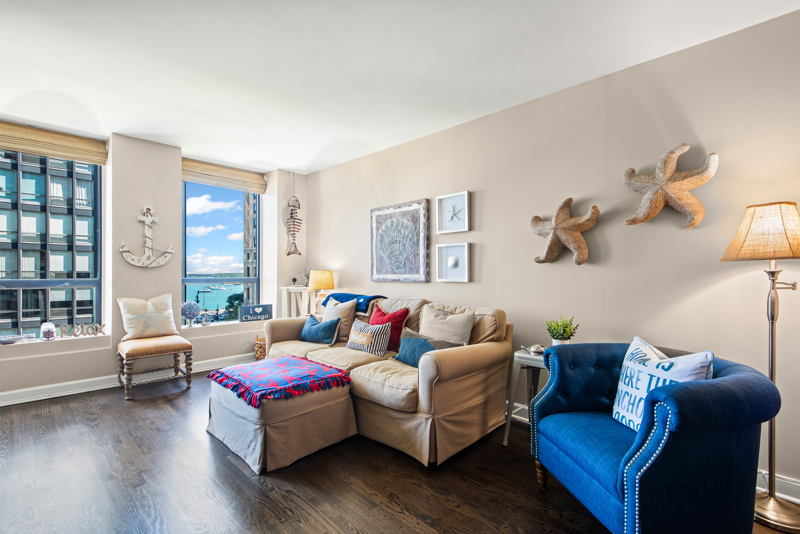 260 East Chestnut Street, Unit 611 Chicago, IL 60611 - Photo 3 of 20 a living room with furniture and a large window