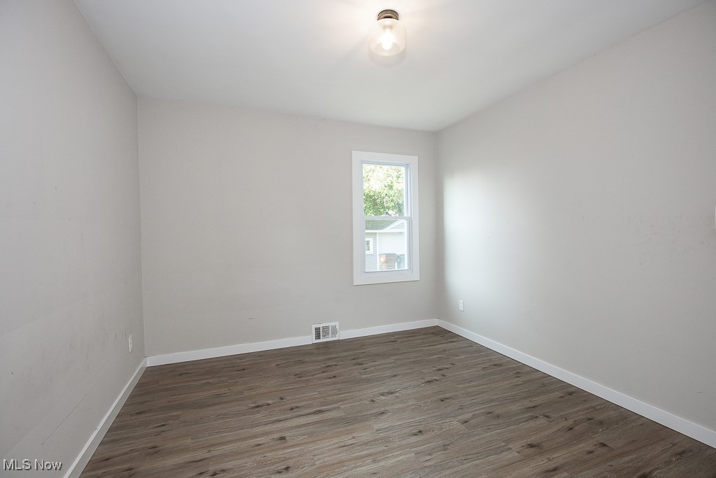 5607 Ridgewood Avenue Parma, OH 44129 - Photo 12 of 23 Empty room featuring wood-type flooring
