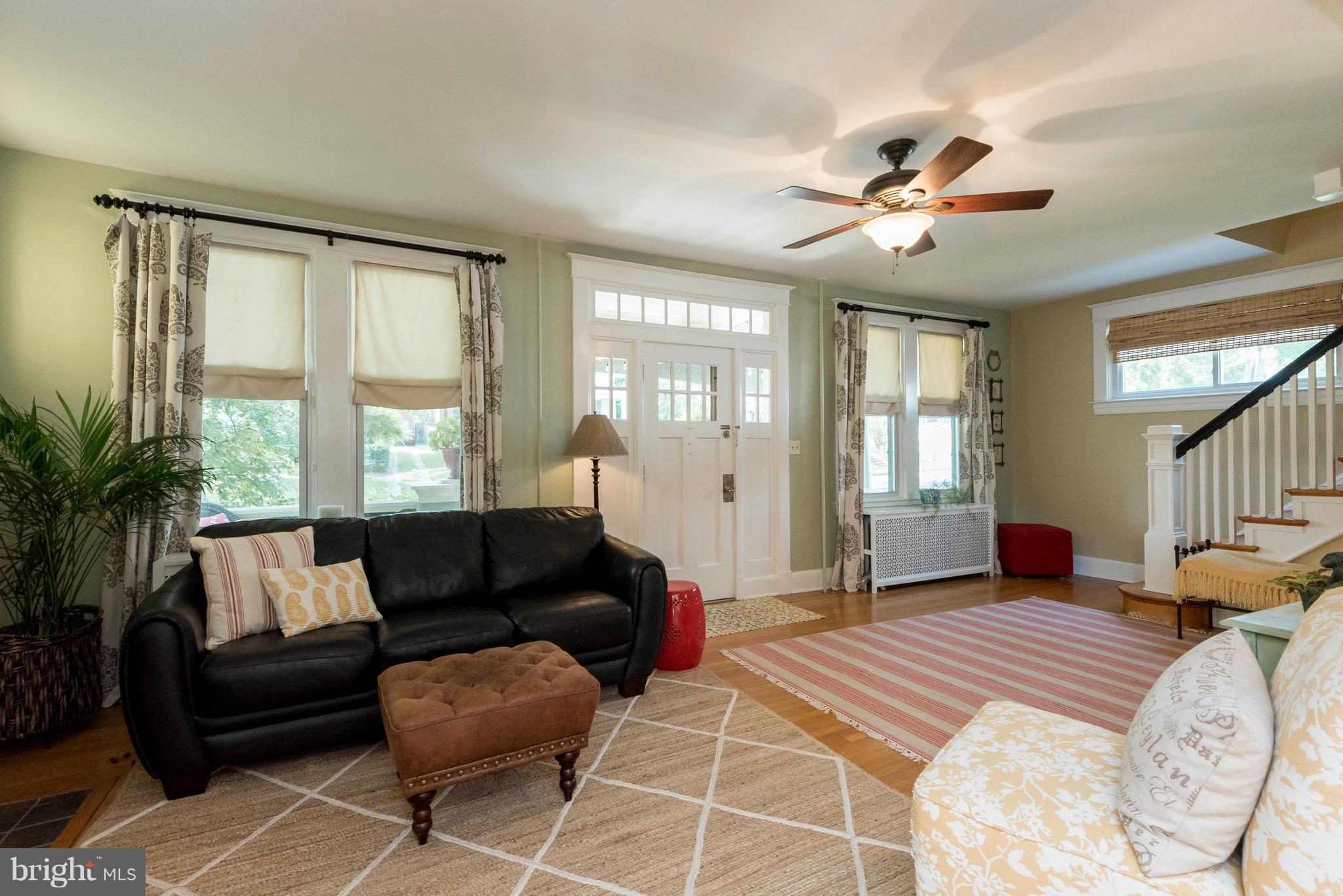 3 Mallow Hill Road Baltimore, MD 21229 - Photo 11 of 30 a spacious bedroom with a bed a couch and windows