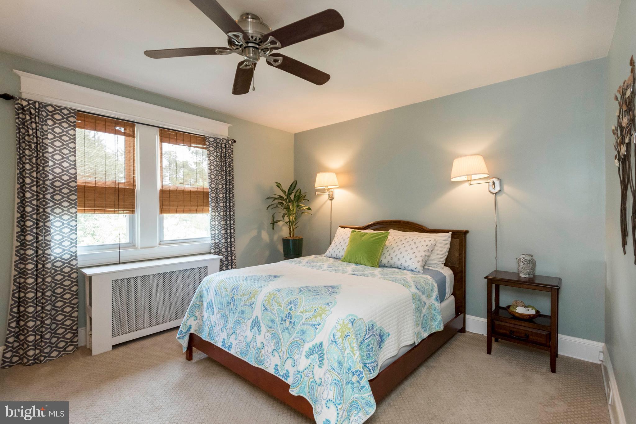 3 Mallow Hill Road Baltimore, MD 21229 - Photo 14 of 30 a bedroom with a bed and a chandelier