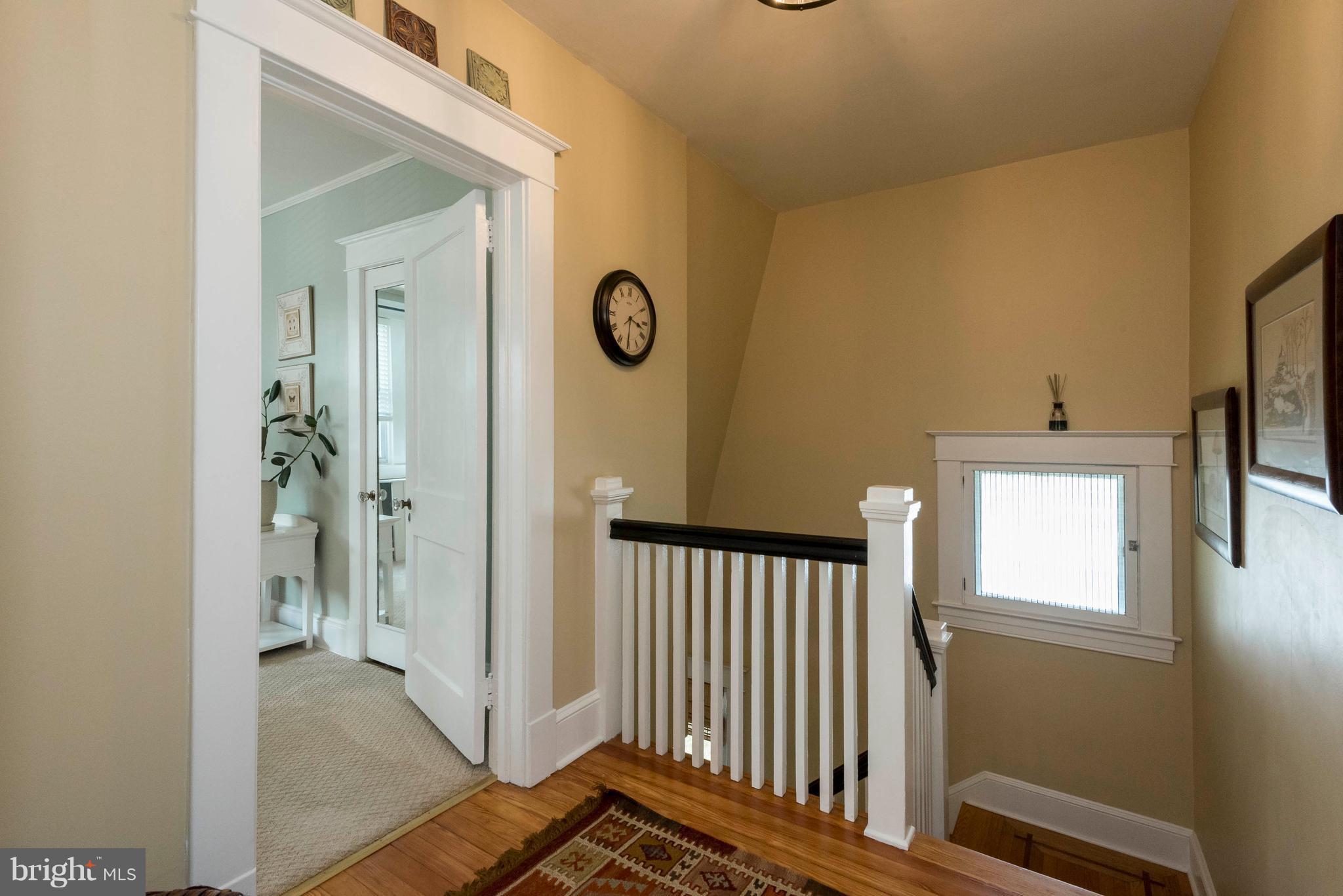 3 Mallow Hill Road Baltimore, MD 21229 - Photo 16 of 30 a view of a hallway with a door and a mirror