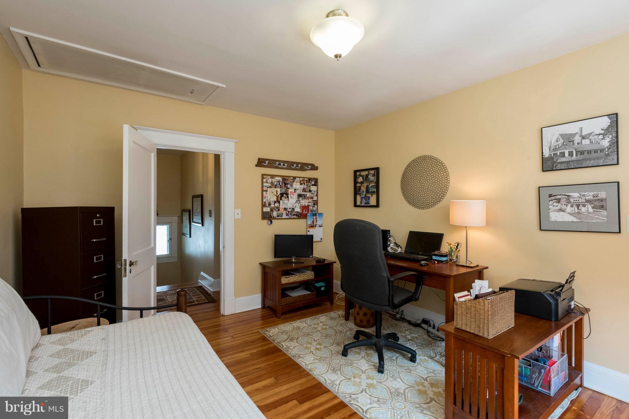 3 Mallow Hill Road Baltimore, MD 21229 - Photo 17 of 30 a view of a workspace with furniture and a bedroom