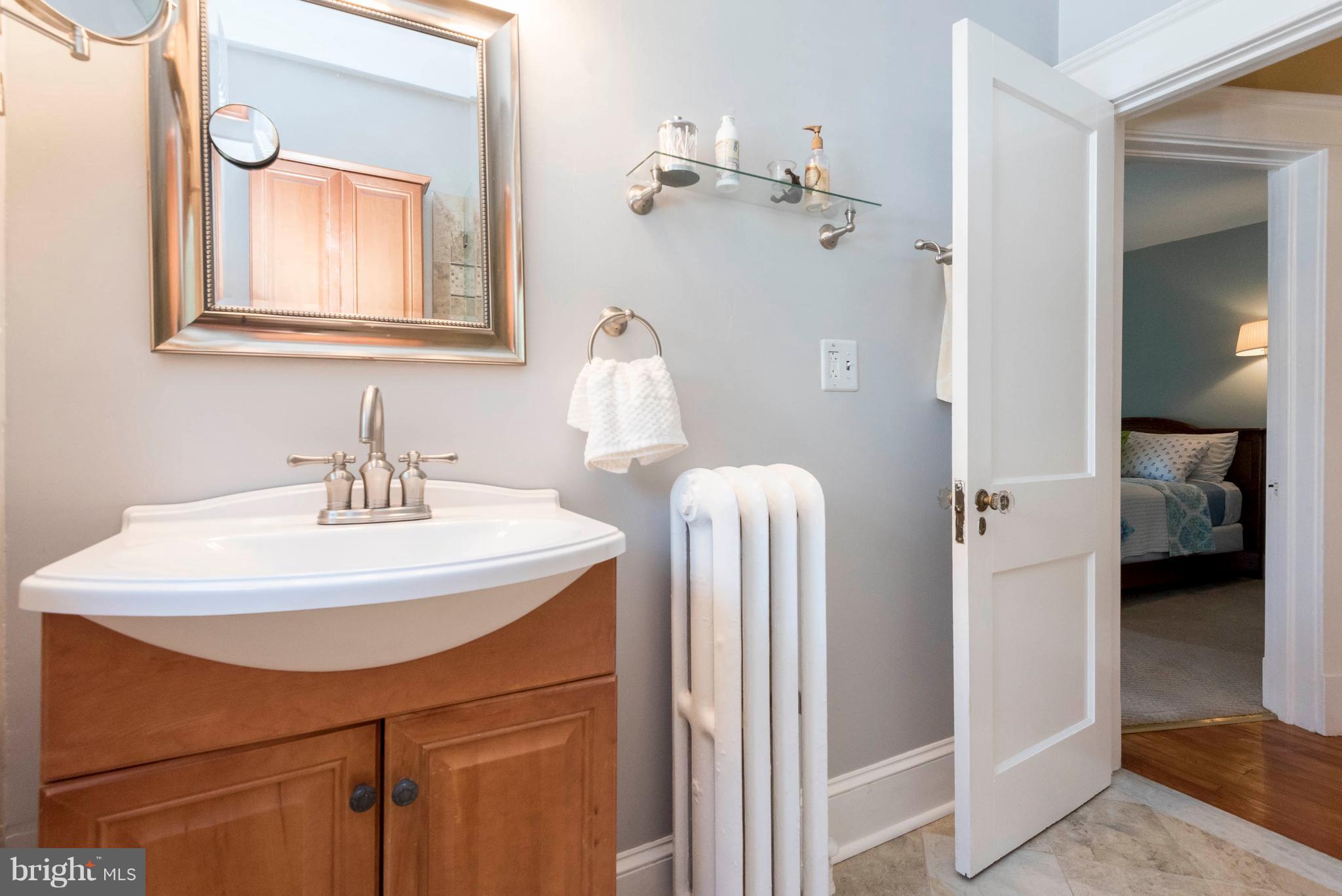 3 Mallow Hill Road Baltimore, MD 21229 - Photo 19 of 30 a bathroom with a sink and a mirror