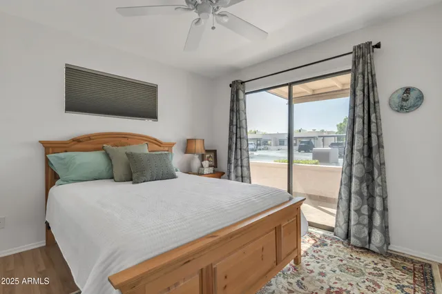 a bedroom with a bed and a table