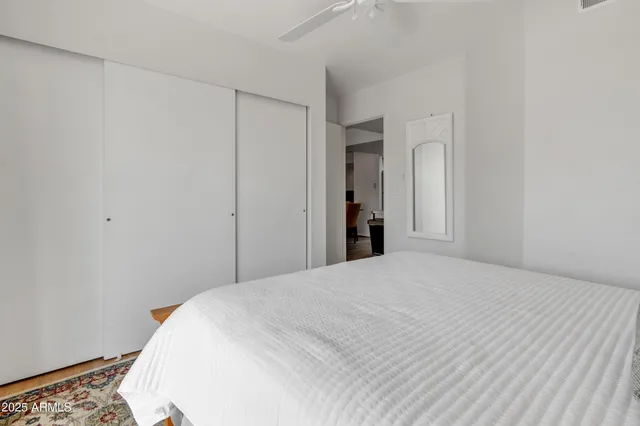 a bedroom with bed and window