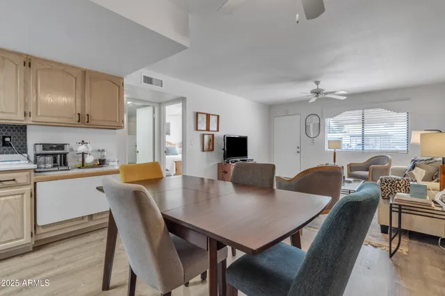 a view of a dining room with furniture and wooden floor