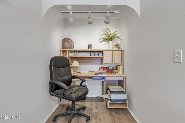 a workspace with furniture and window