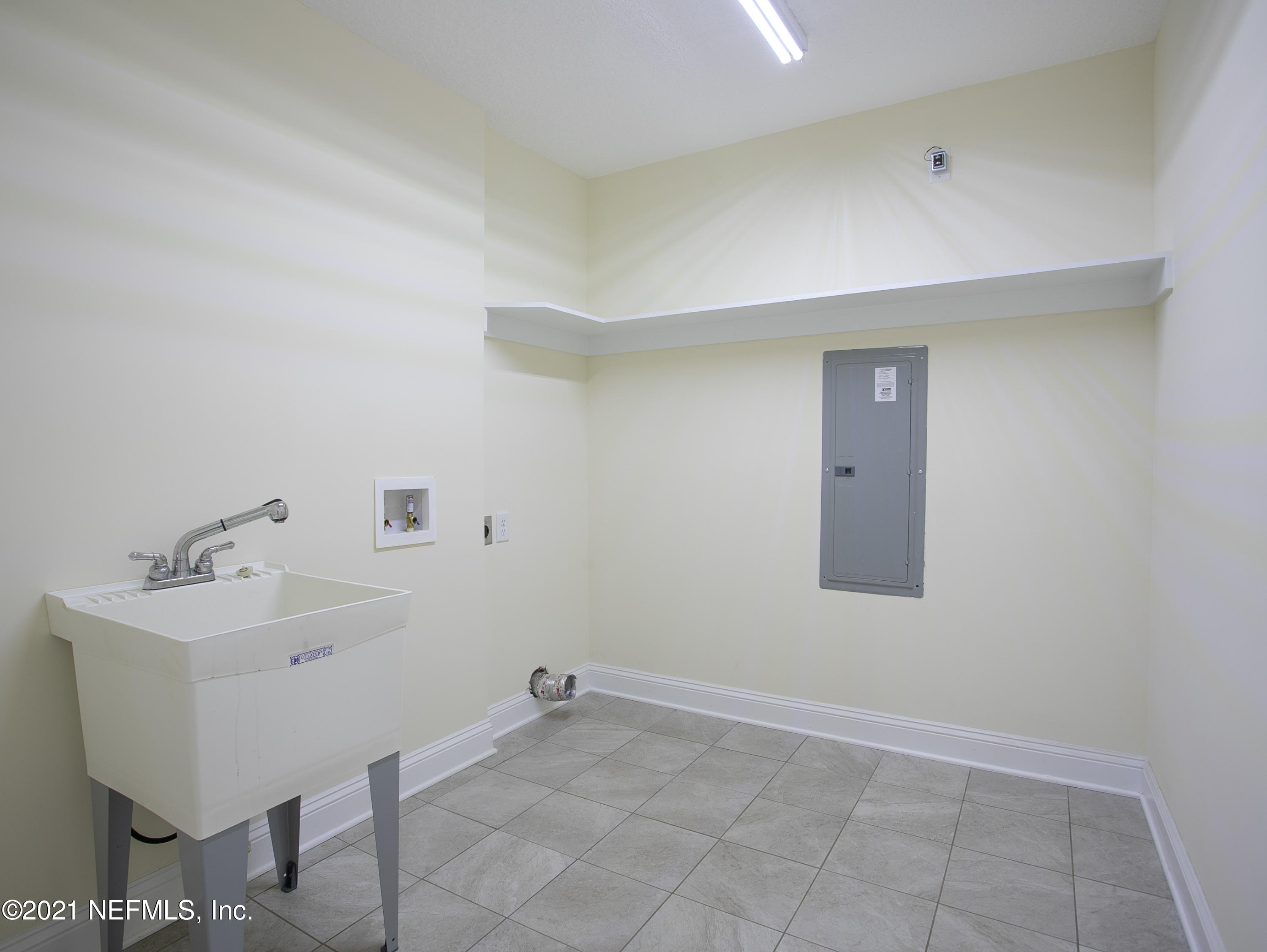 96165 Pirates Bluff Road Yulee, FL 32097 - Photo 23 of 28 a bathroom with a sink and a mirror