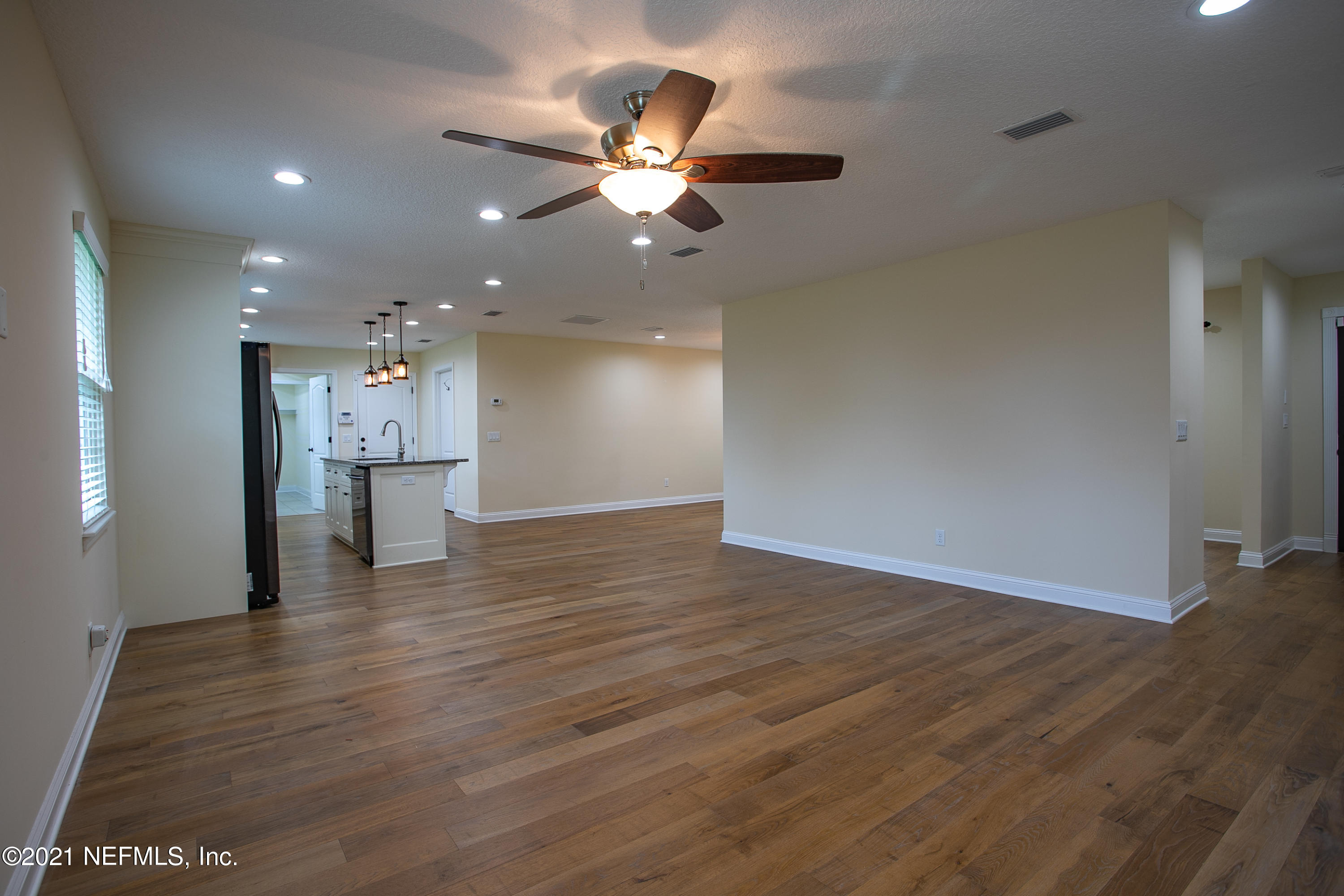 96165 Pirates Bluff Road Yulee, FL 32097 - Photo 8 of 28 a view of empty room with wooden floor
