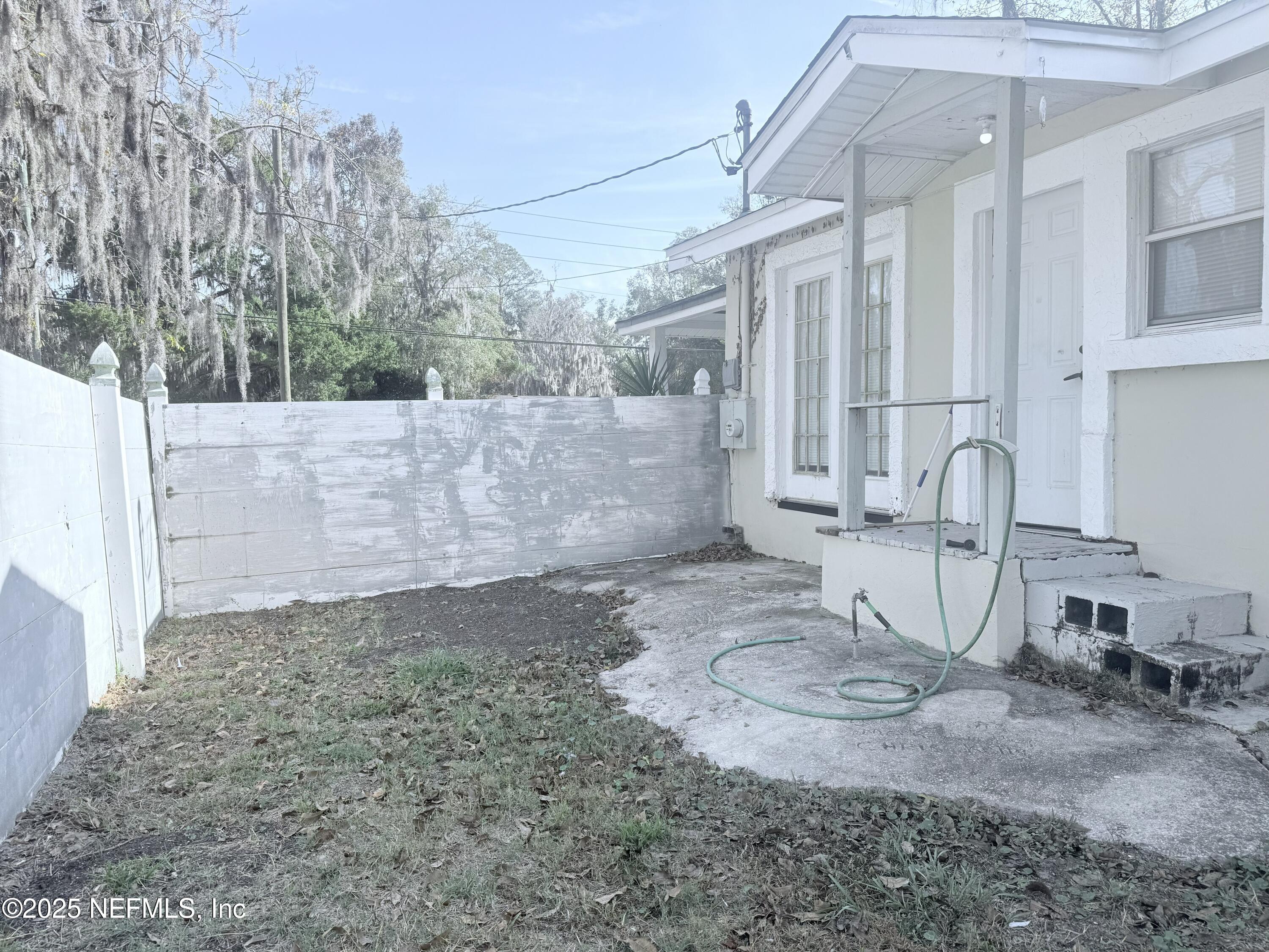 10728 Old Kings Road Jacksonville, FL 32219 - Photo 18 of 27 a view of a house with backyard and sitting area
