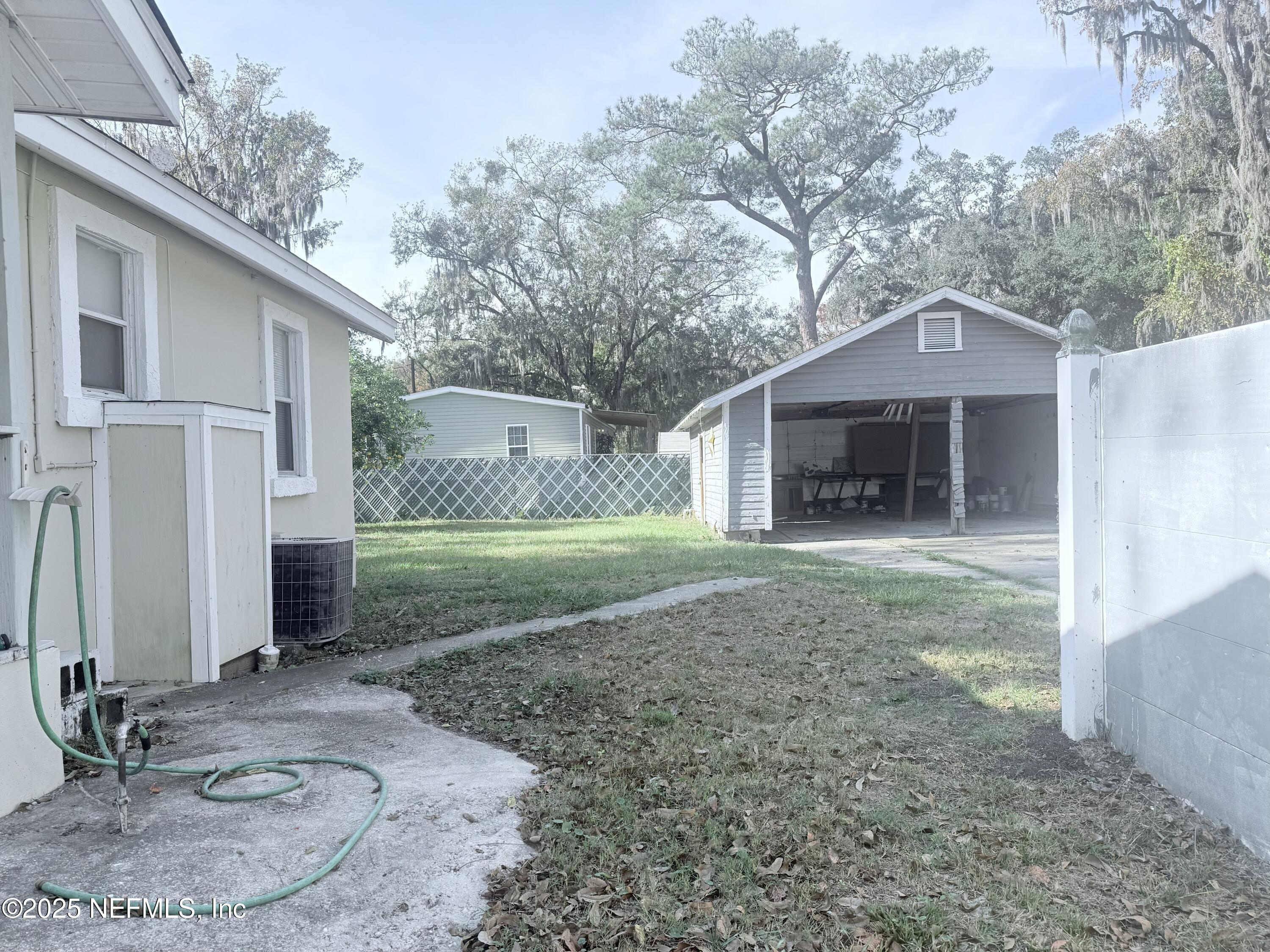 10728 Old Kings Road Jacksonville, FL 32219 - Photo 19 of 27 a backyard of a house with oven and garden