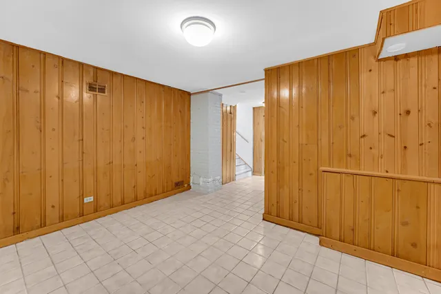 a view of a livingroom with wooden walls