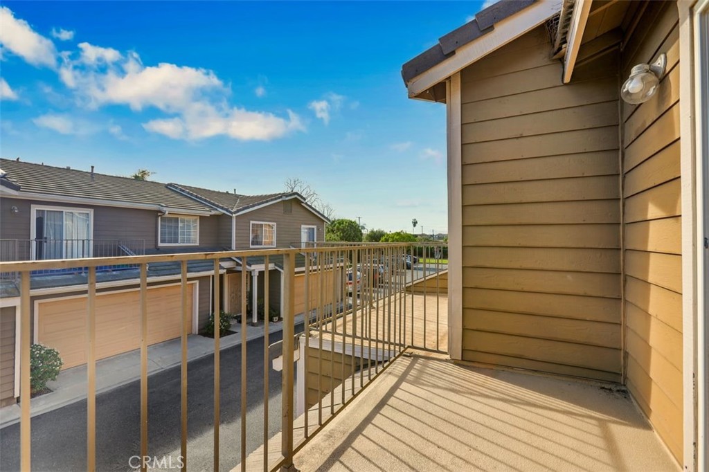755 North East Street Anaheim, CA 92805 - Photo 12 of 31 a view of a balcony with wooden floor and fence