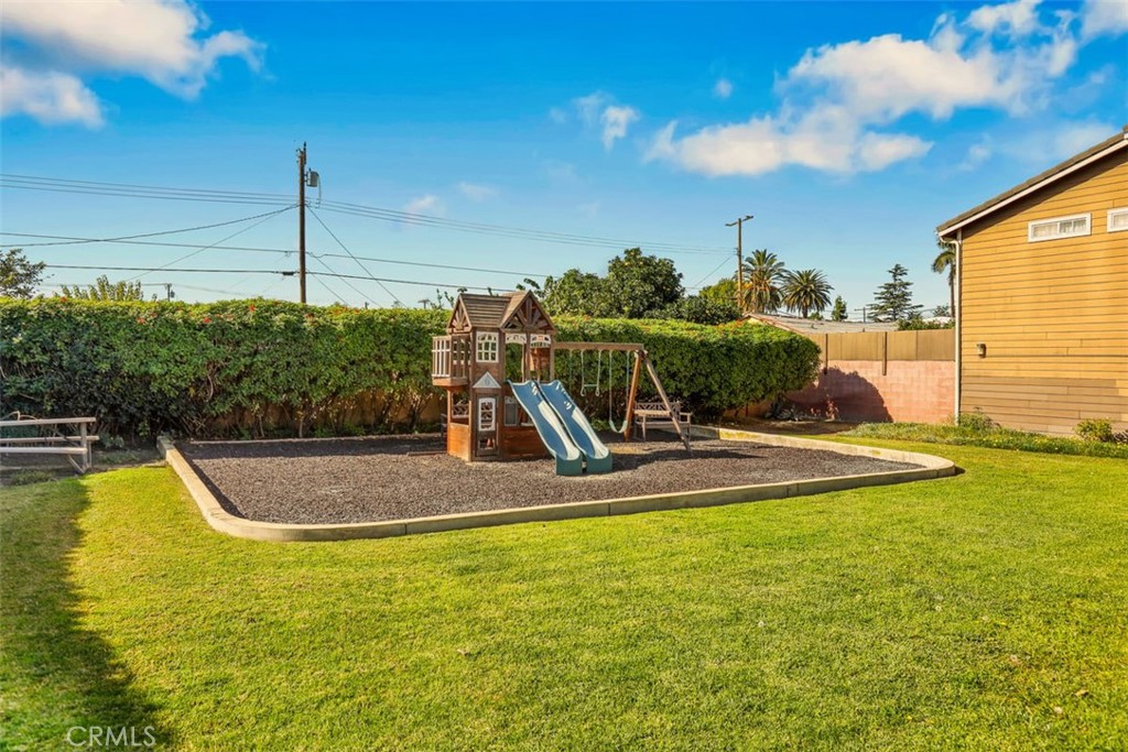 755 North East Street Anaheim, CA 92805 - Photo 2 of 31 a view of a swimming pool with a yard