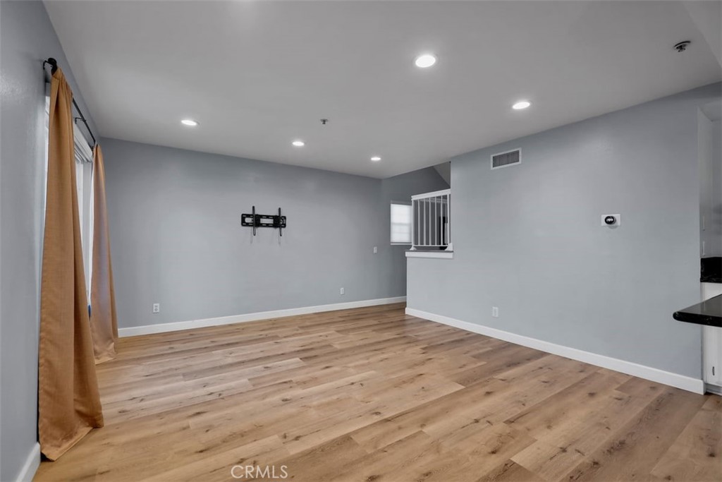 755 North East Street Anaheim, CA 92805 - Photo 24 of 31 an empty room with wooden floor and windows