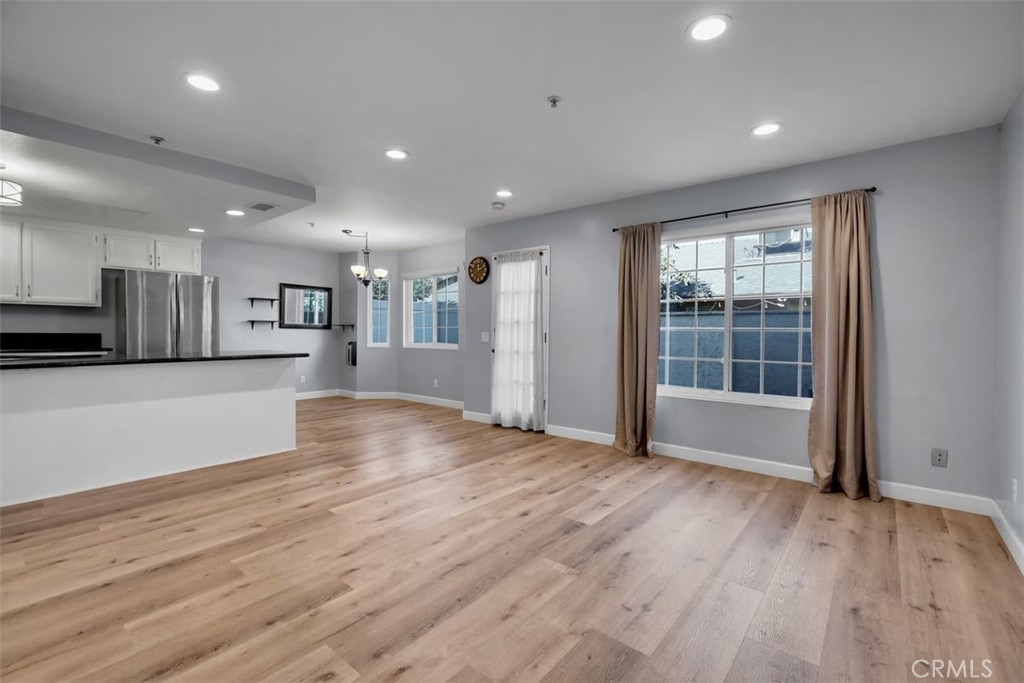 755 North East Street Anaheim, CA 92805 - Photo 27 of 31 an empty room with wooden floor and windows