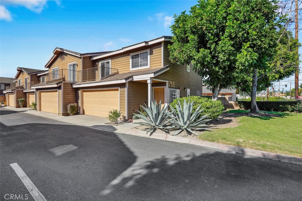 755 North East Street Anaheim, CA 92805 - Photo 31 of 31 a front view of a house with a garden and yard