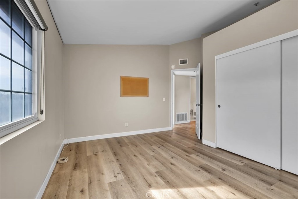 755 North East Street Anaheim, CA 92805 - Photo 10 of 31 a view of an empty room with wooden floor and a window