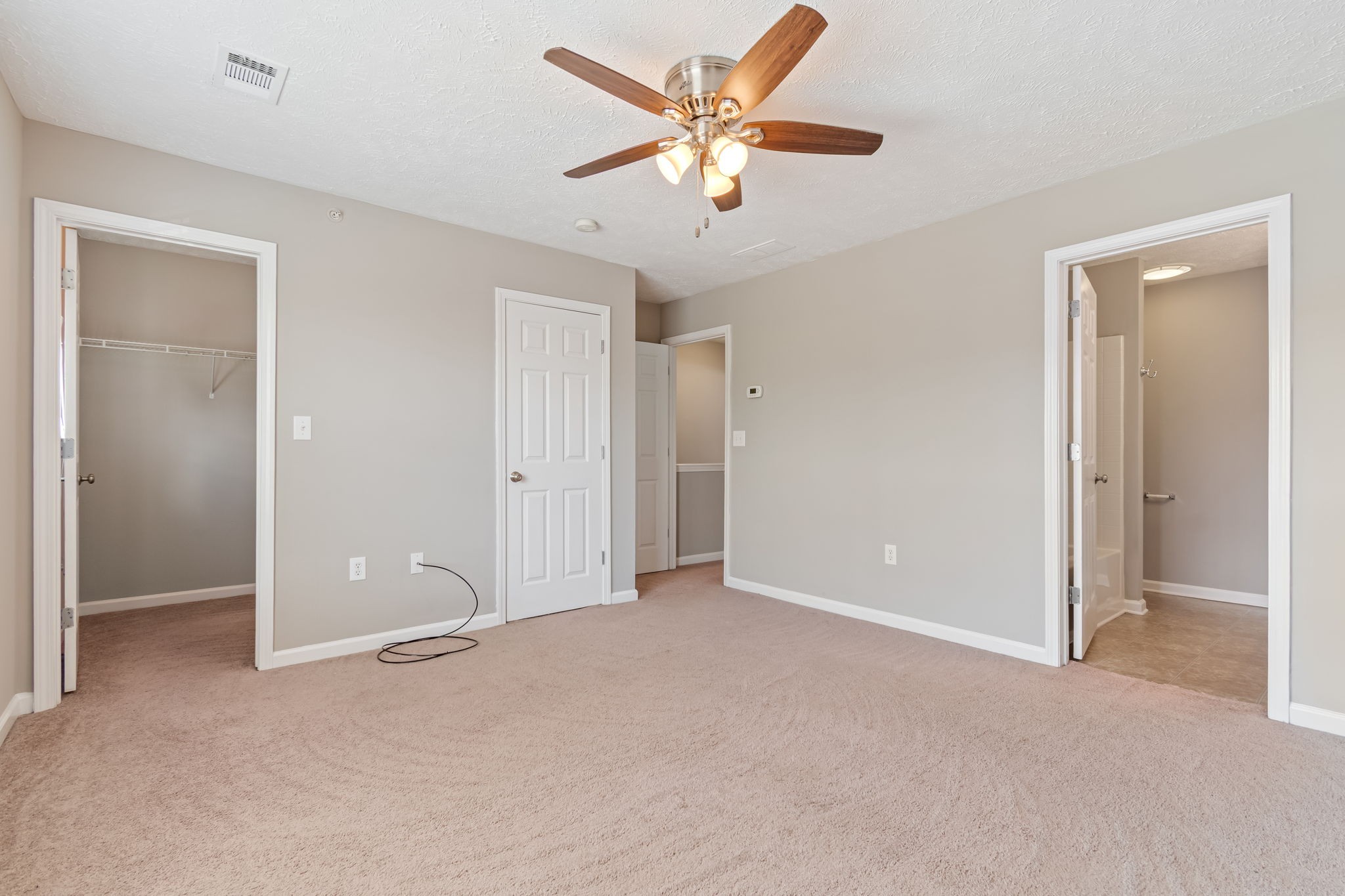 1020 Somerset Springs Drive Spring Hill, TN 37174 - Photo 9 of 13 an empty room with closet and a ceiling fan