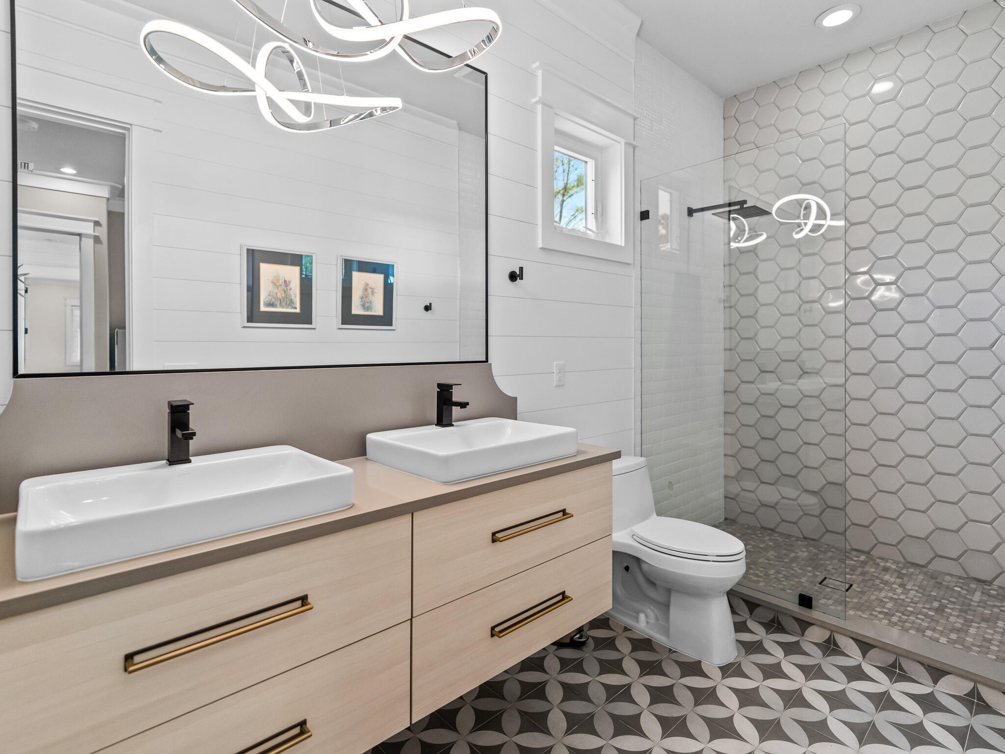 16 South Lake Drive Santa Rosa Beach, FL 32459 - Photo 21 of 70 a bathroom with a sink a toilet a mirror and shower