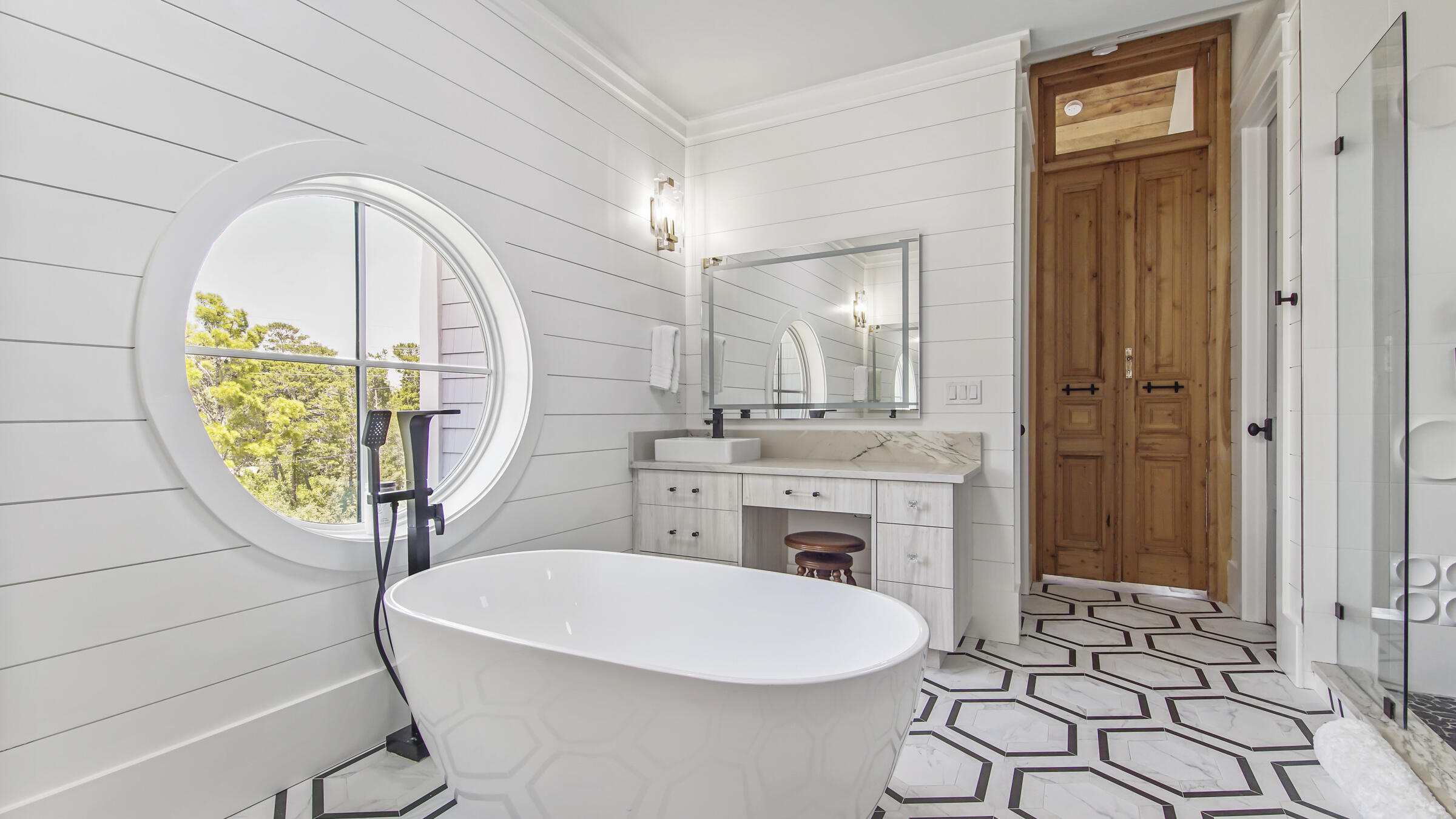 16 South Lake Drive Santa Rosa Beach, FL 32459 - Photo 28 of 70 a bathroom with a sink a mirror and a shower