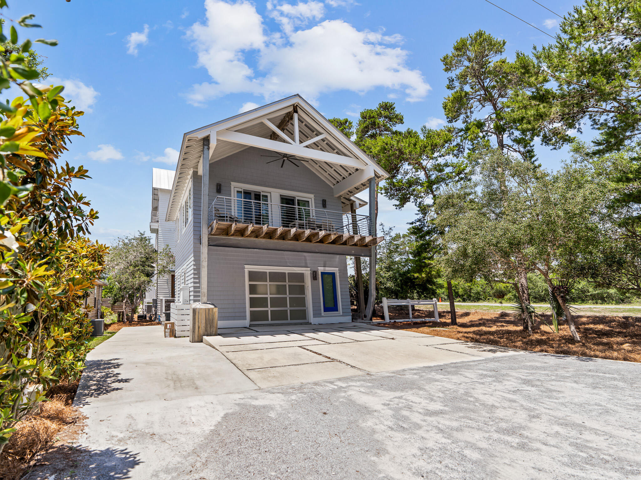 16 South Lake Drive Santa Rosa Beach, FL 32459 - Photo 3 of 70 a front view of a house with a yard