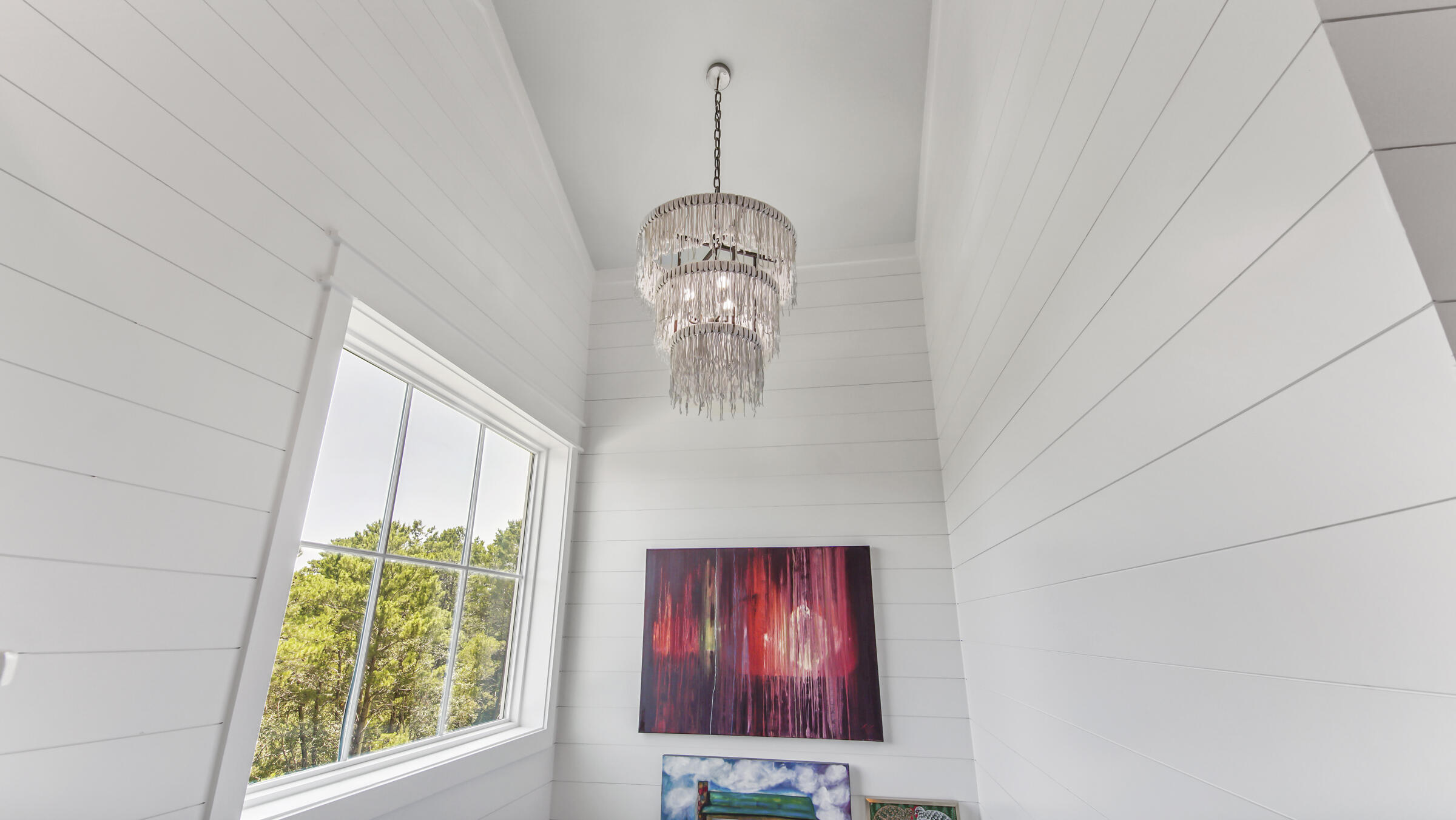 16 South Lake Drive Santa Rosa Beach, FL 32459 - Photo 41 of 70 a picture of a room that has a window and a chandelier
