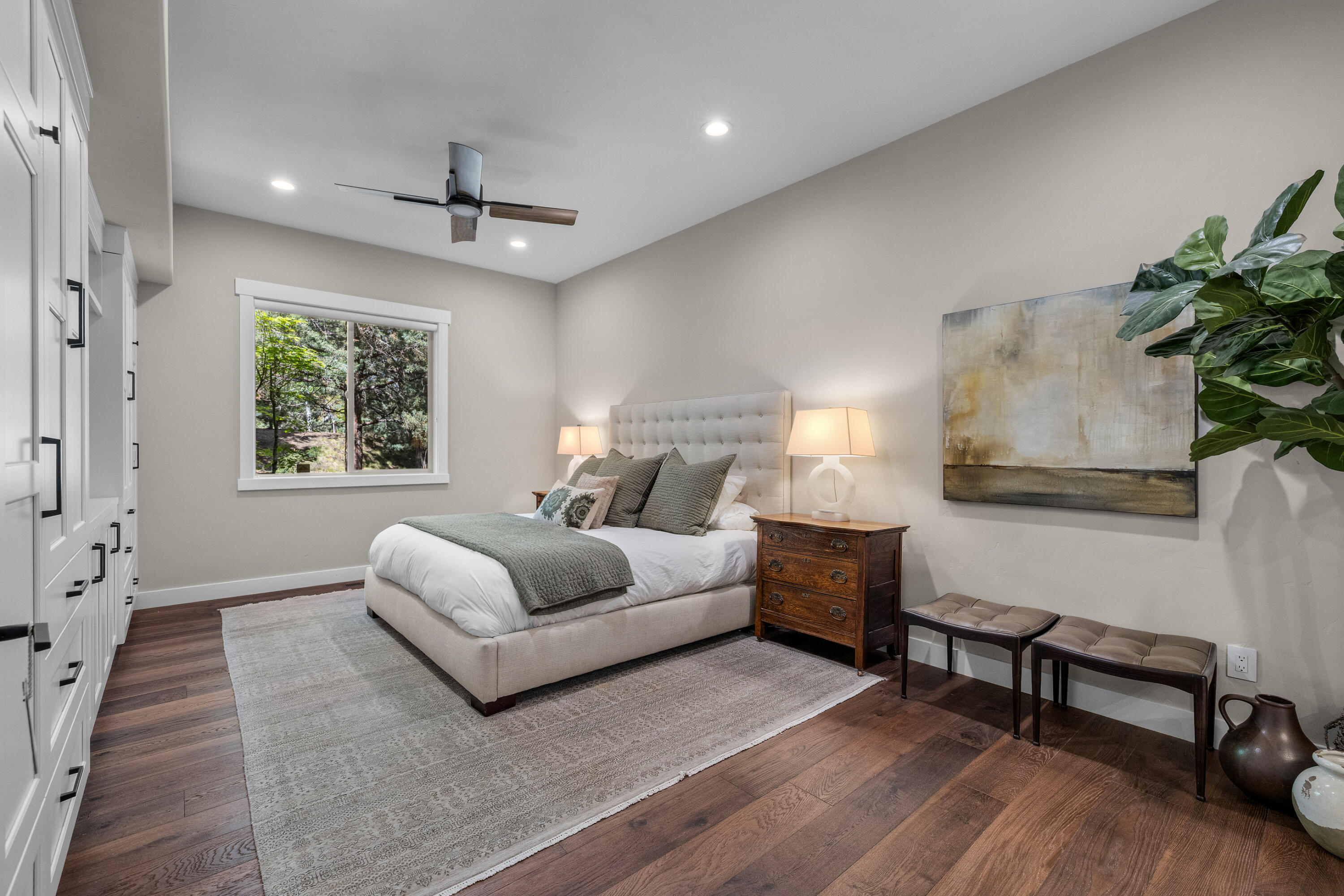 19460 Chip Shot Lane Bend, OR 97702 - Photo 23 of 56 a spacious bedroom with a bed and a couch