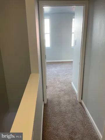 a view of a hallway with closet area