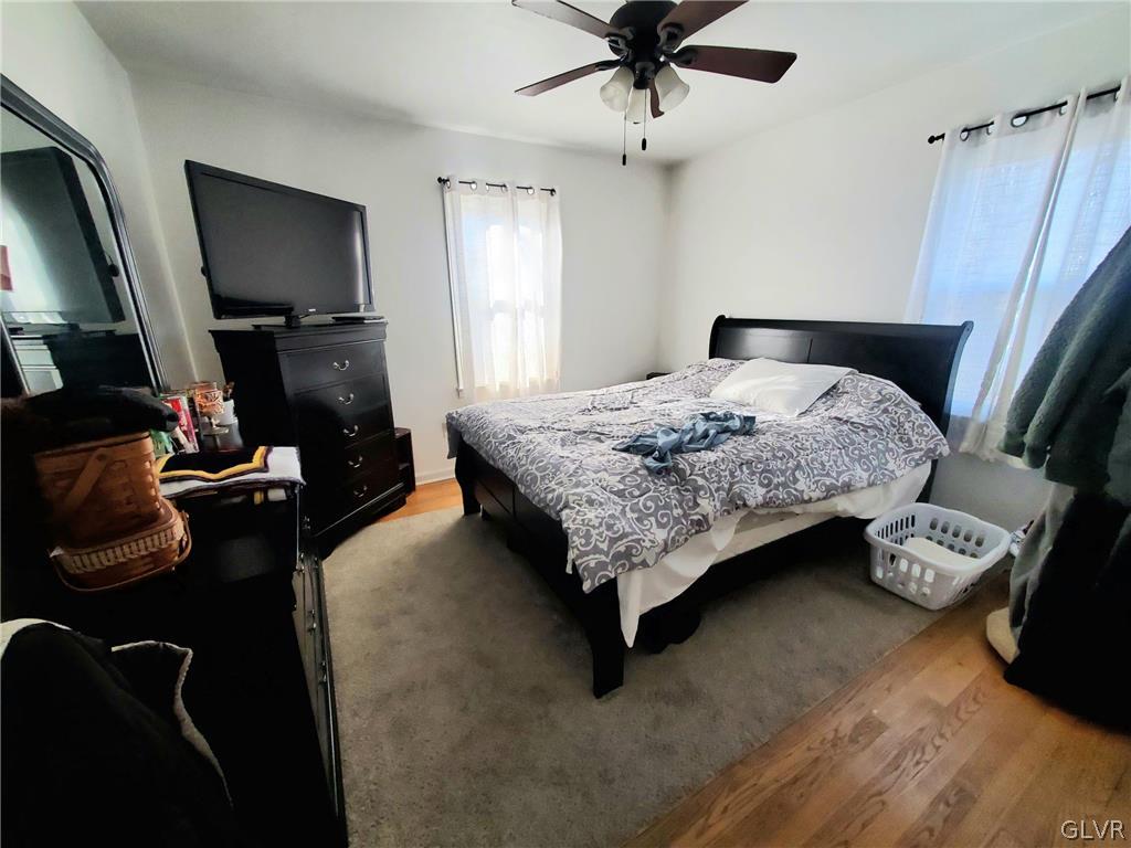535 Forrest Avenue Bethlehem, PA 18017 - Photo 11 of 16 a bedroom with a bed and a flat tv screen on dresser