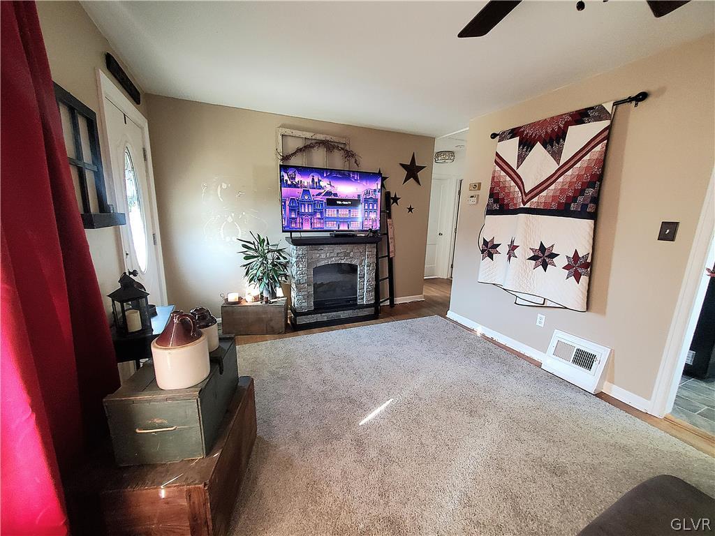 535 Forrest Avenue Bethlehem, PA 18017 - Photo 3 of 16 a living room with furniture and a fireplace