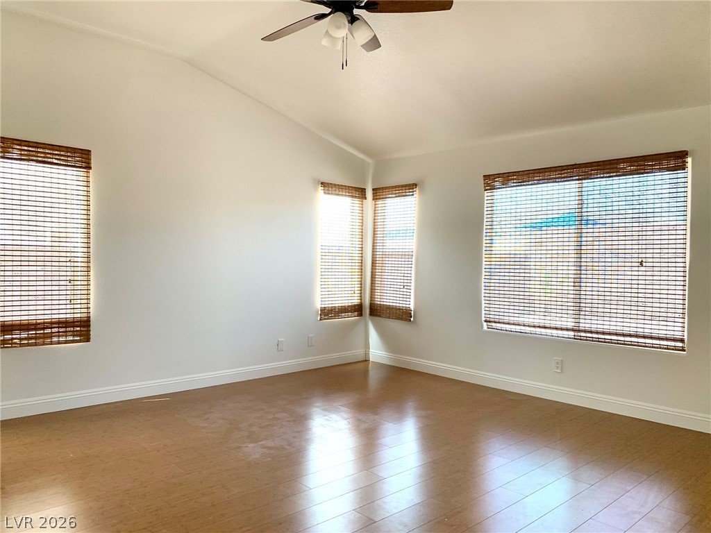 3821 Bombastic Court Las Vegas, NV 89147 - Photo 17 of 36 Bright and airy interior with high ceilings and warm wooden flooring.