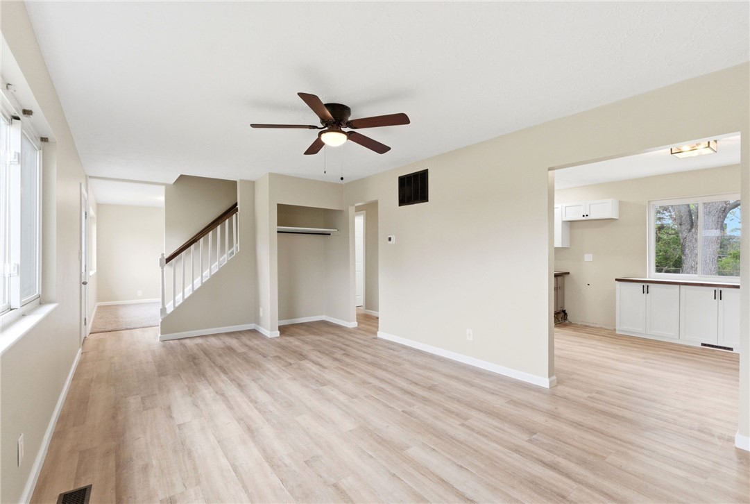 40 Woods Road Springboro, OH 45066 - Photo 36 of 57 This airy living space features wood flooring, a ceiling fan, and seamless flow into an adjacent area.