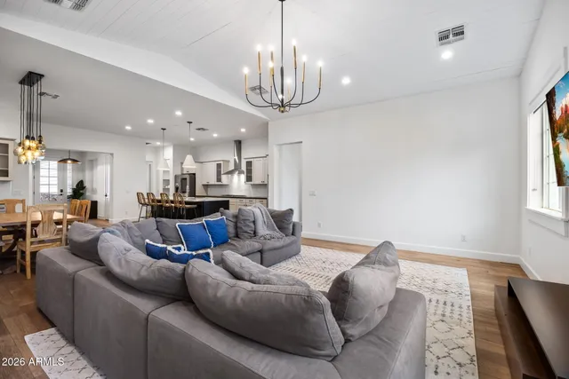a bedroom with a bed ceiling fan and a window