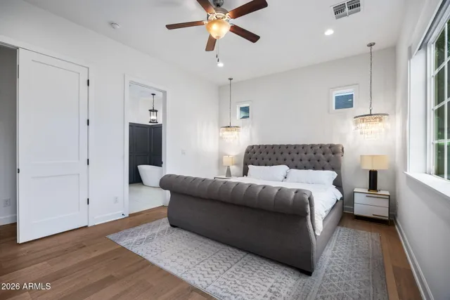 a bathroom with a granite countertop a sink and a mirror