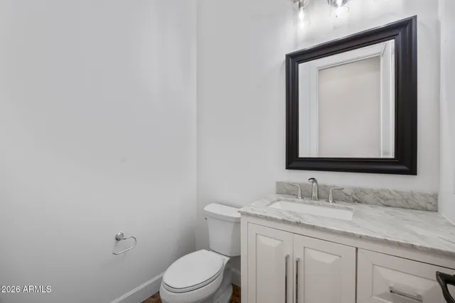 a utility room with sink dryer and washer