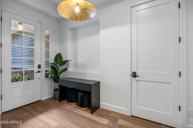 a view of an entryway with wooden floor