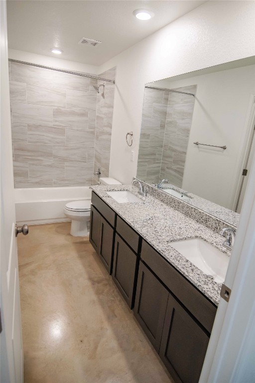 1261 Lehmann Drive, Unit A Copperas Cove, TX 76522 - Photo 11 of 18 a bathroom with a granite countertop sink a toilet and bathtub
