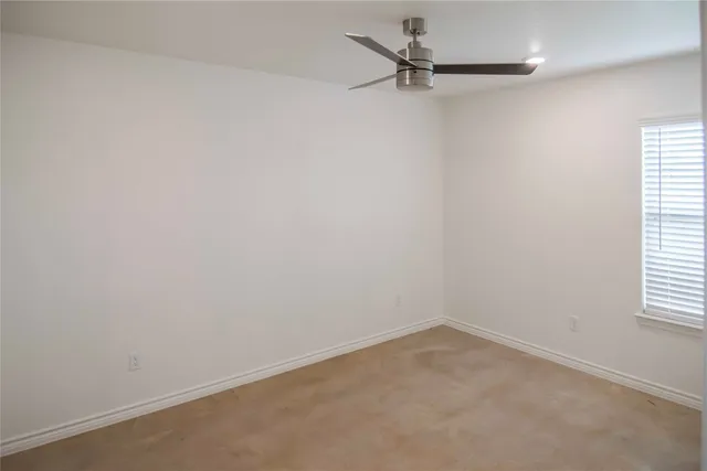 a bathroom with a granite countertop sink a toilet and bathtub
