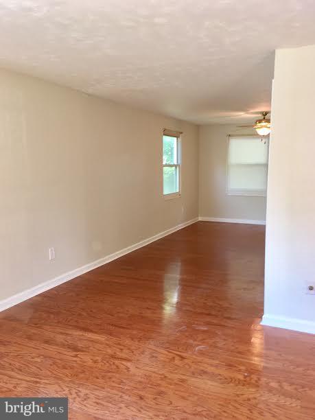 7618 Burnside Road Landover, MD 20785 - Photo 3 of 17 Living room leading to dining rom