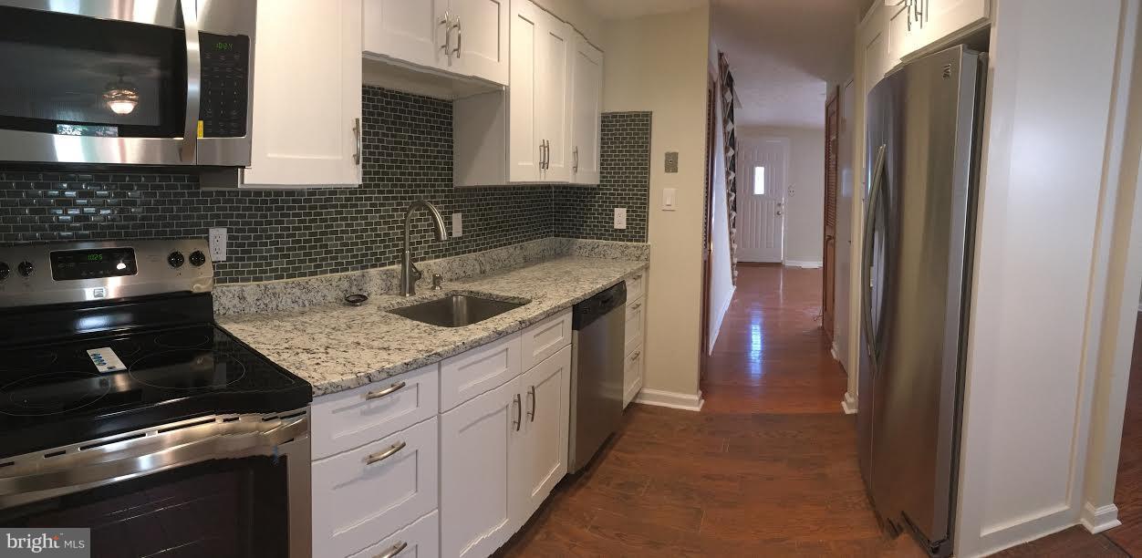 7618 Burnside Road Landover, MD 20785 - Photo 4 of 17 Gourmet kitchen and hall to main level bath