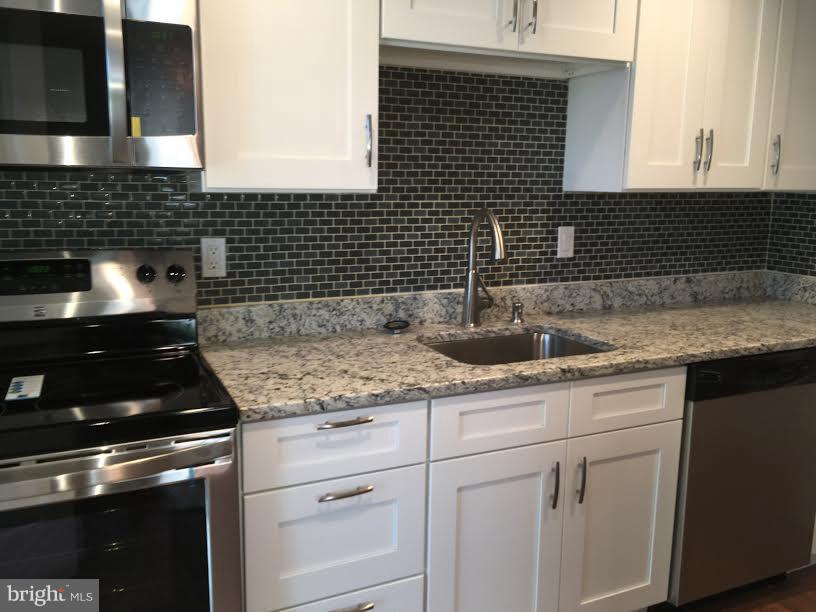 7618 Burnside Road Landover, MD 20785 - Photo 6 of 17 Gourmet kitchen w/ granite & stainless steel