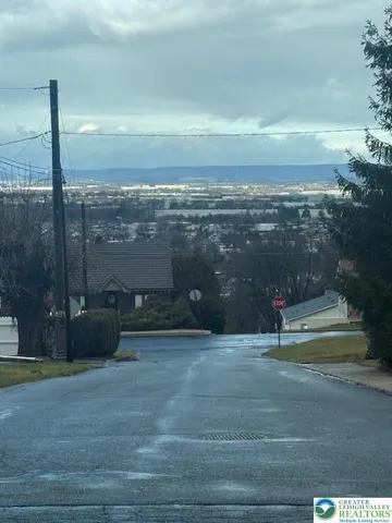 a view of a backyard with sitting area