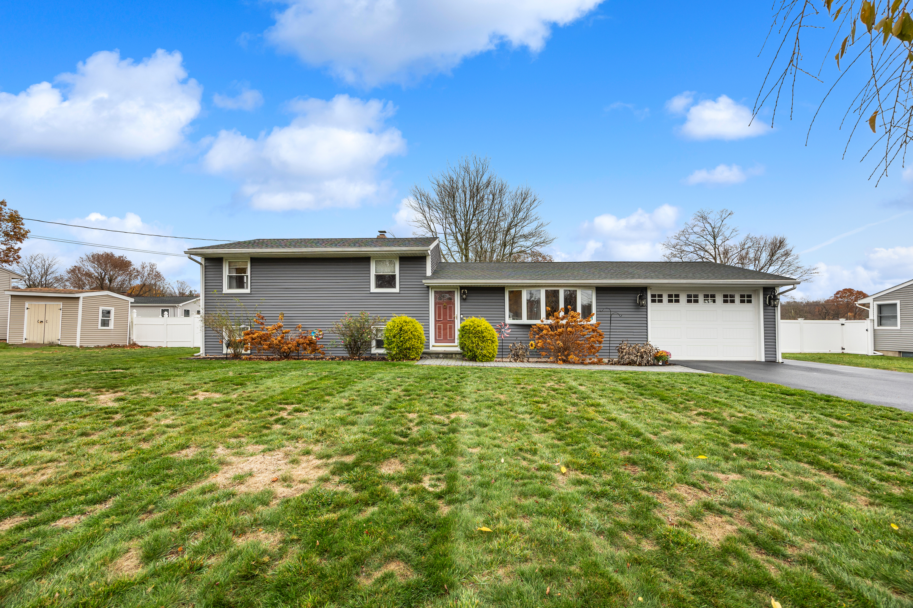 a front view of a house with garden