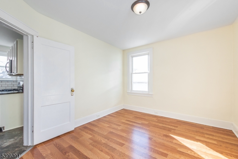 11 Lewis Street, Unit 1 Bloomfield, NJ 07003 - Photo 8 of 25 a view of empty room with wooden floor