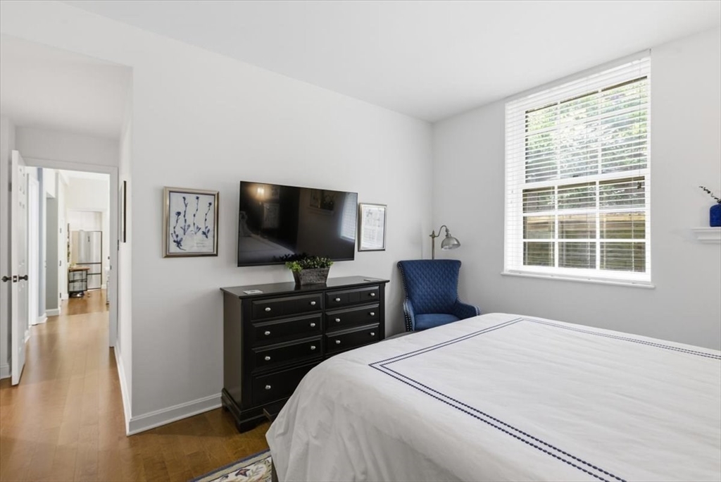 65 Glen Road, Unit H1 Brookline, MA 02445 - Photo 23 of 39 a bedroom with a bed and a flat screen tv