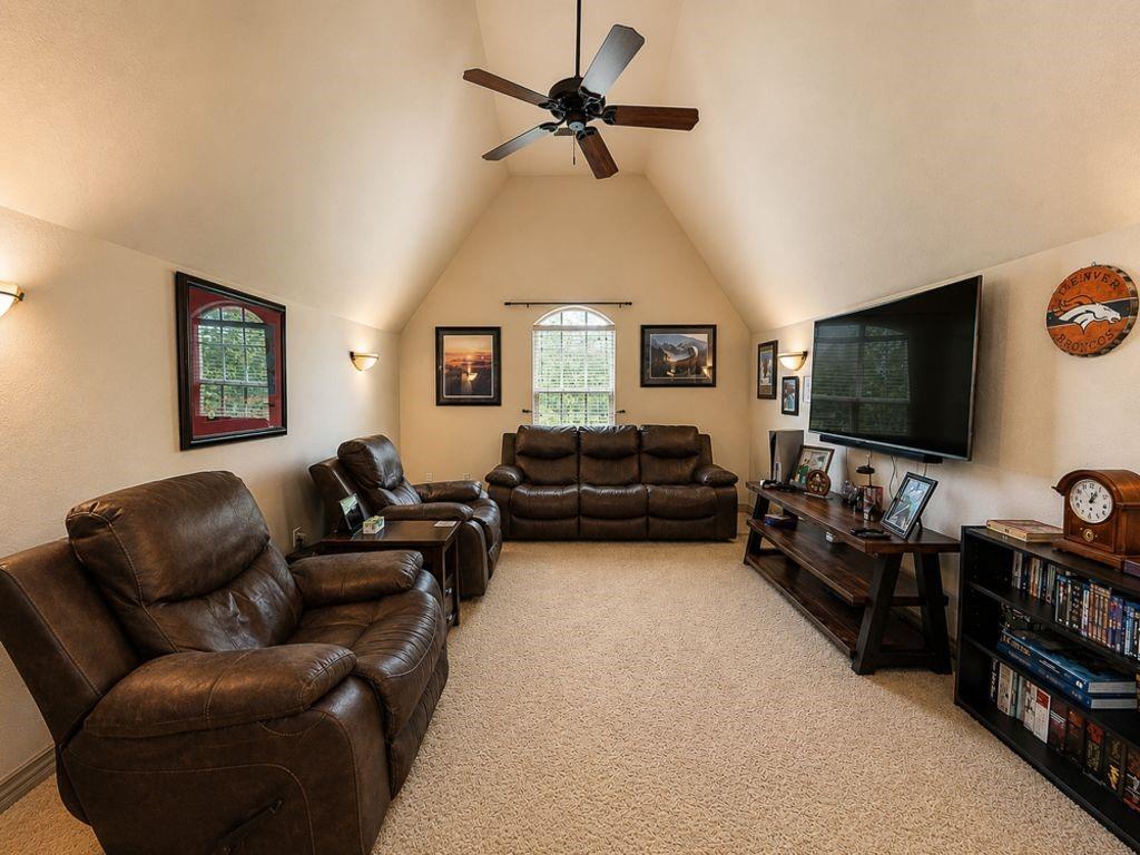 7005 Peter's Path Colleyville, TX 76034 - Photo 32 of 40 a living room with furniture and a flat screen tv