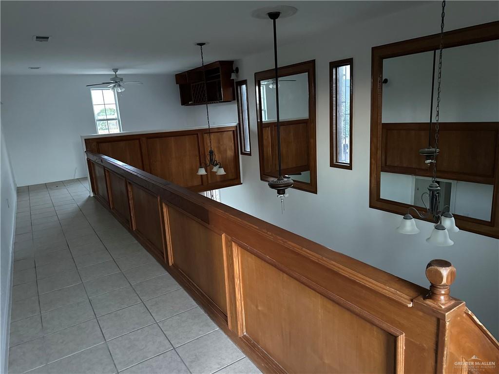 12517 North Taylor Road Mission, TX 78573 - Photo 11 of 22 a kitchen with stainless steel appliances a sink and a microwave