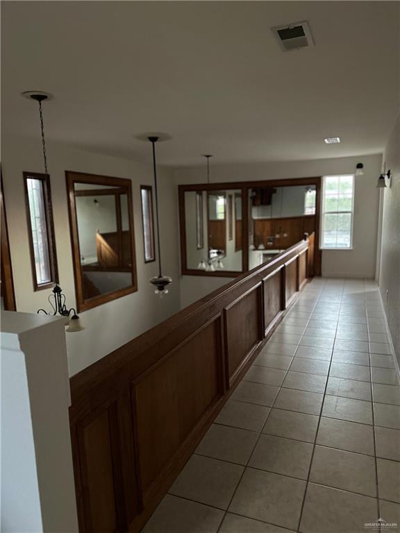 12517 North Taylor Road Mission, TX 78573 - Photo 12 of 22 a large kitchen with granite countertop a stove a sink and a refrigerator